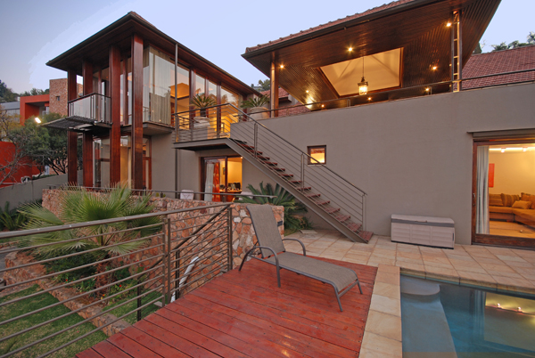 Real estate photography -exterior dusk of a double story house and pool