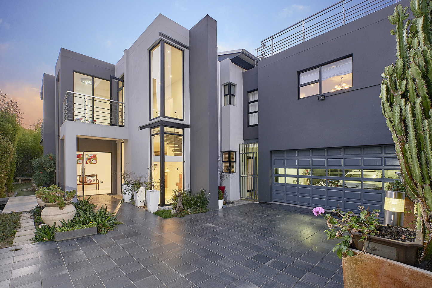 Real estate photography-double storey grey house at dusk